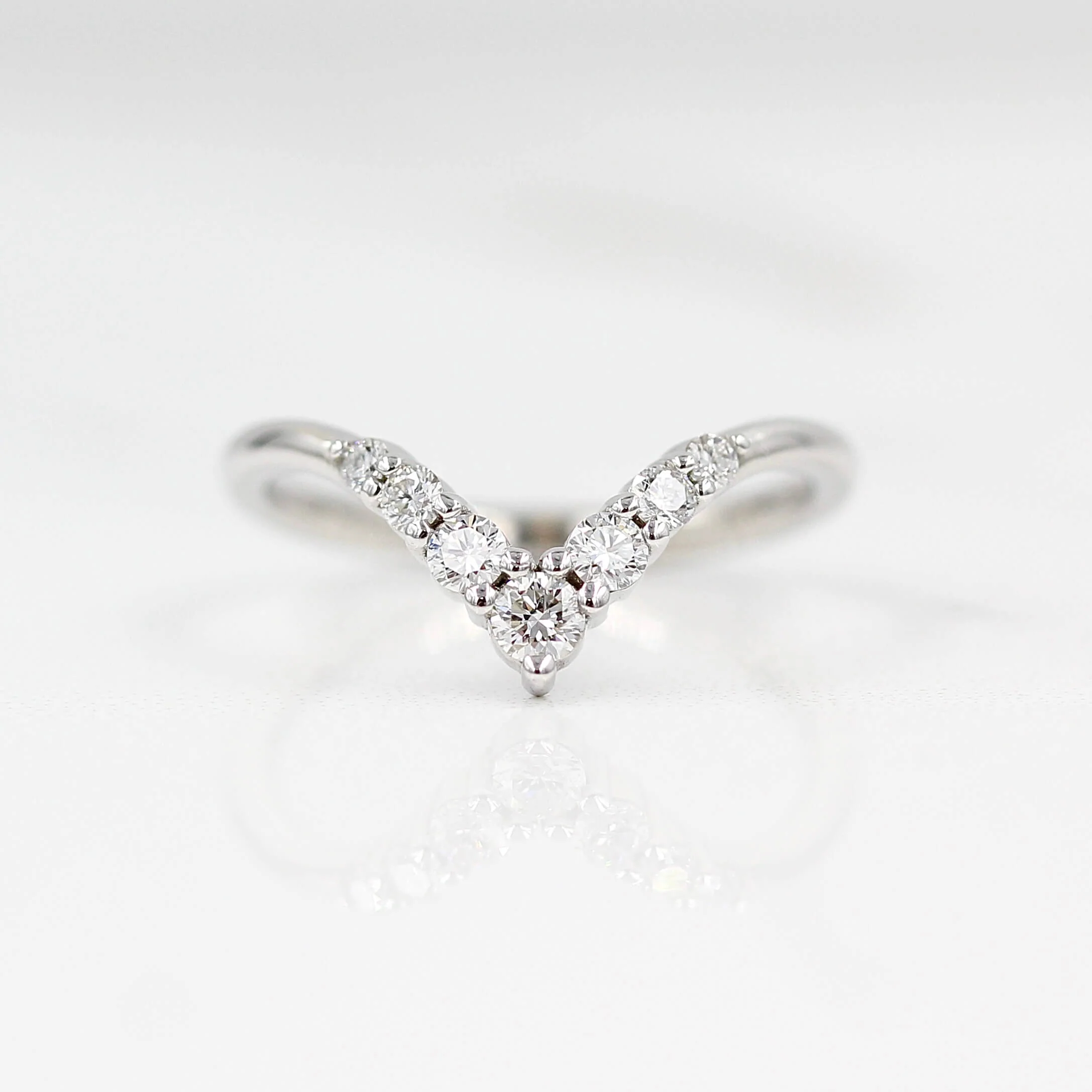 The Graduated Diamond V Wedding Band