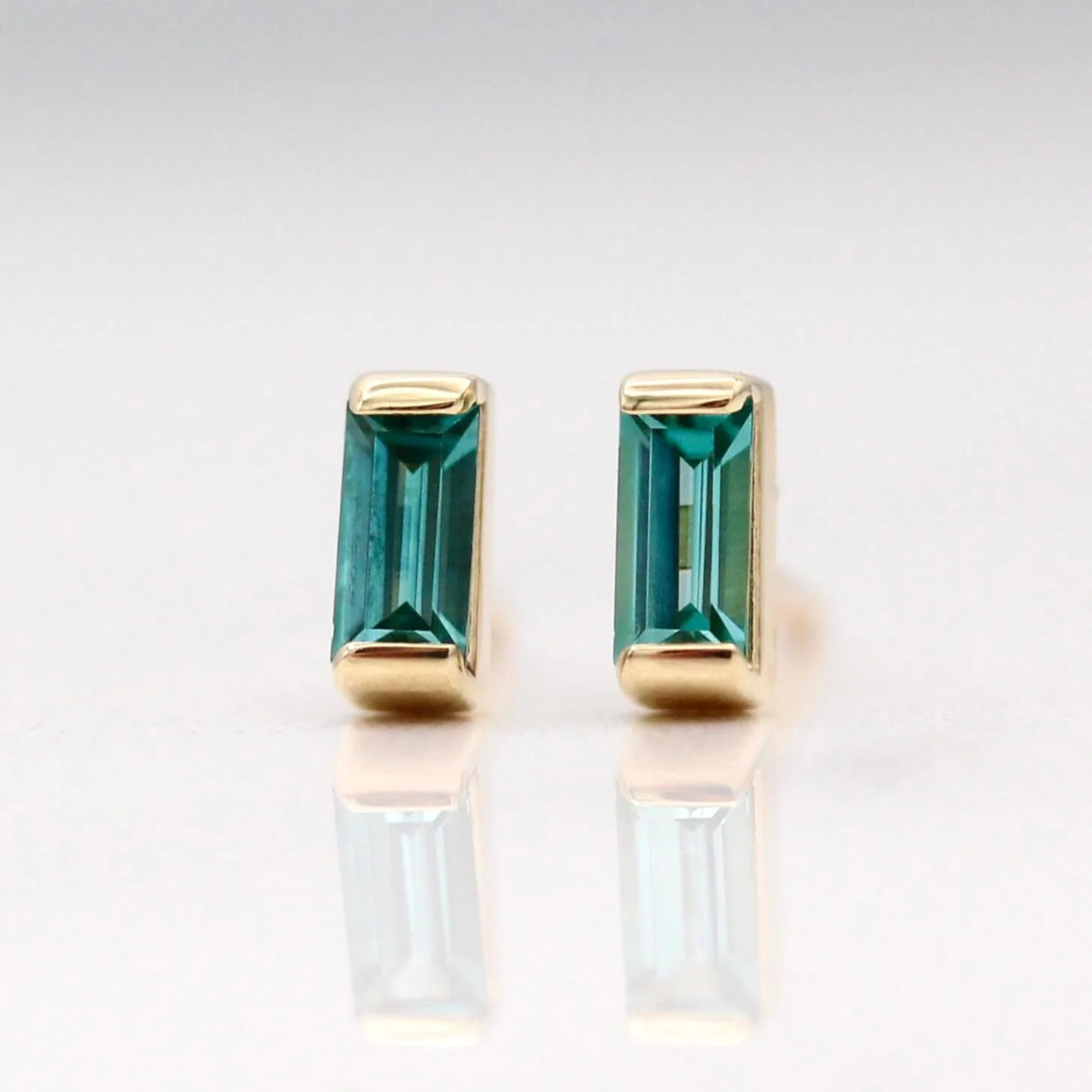 The December Baguette Birthstone Earrings with Paraiba Spinel in Yellow Gold