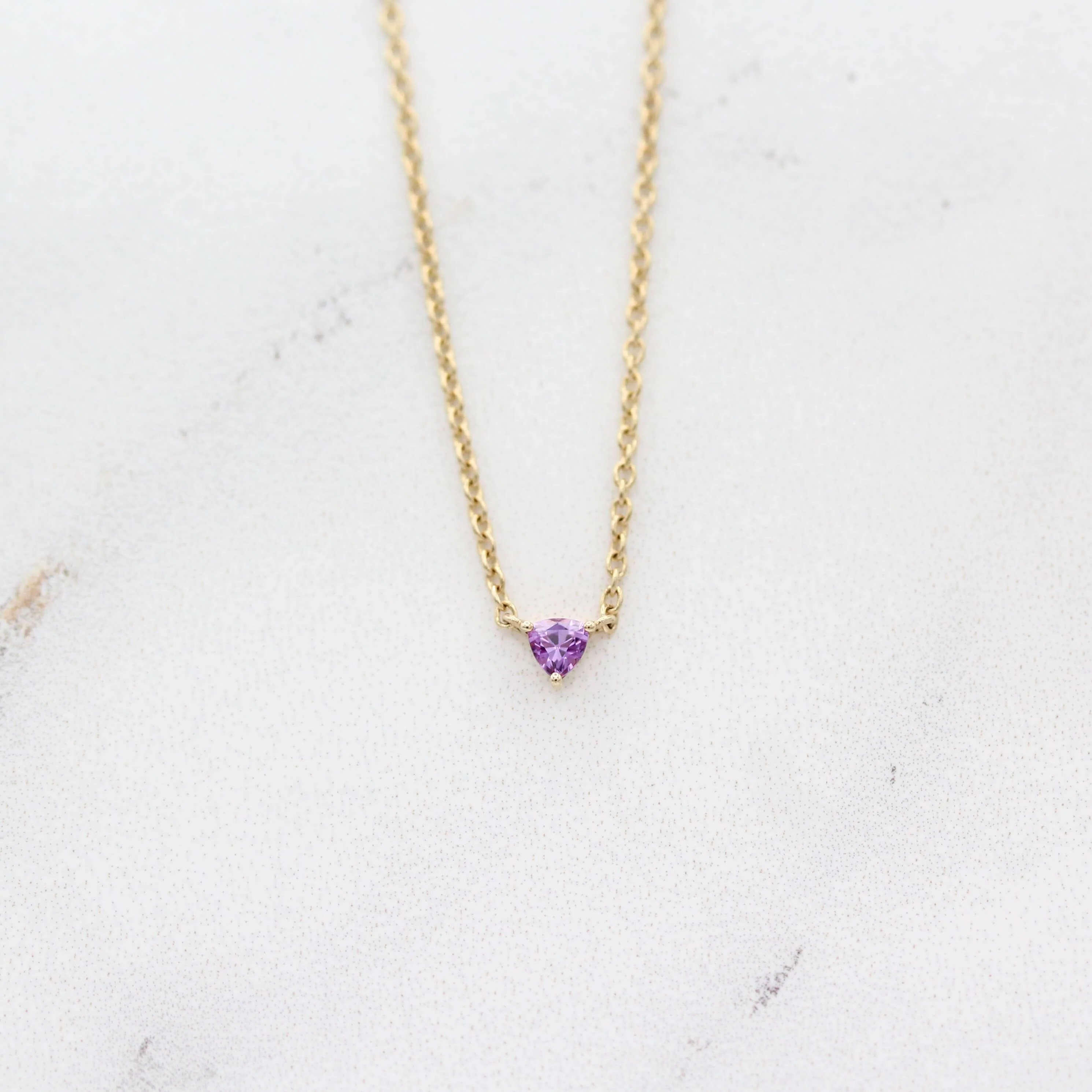 The February Tiny Trillion Birthstone Necklace with Purple Sapphire in Yellow Gold