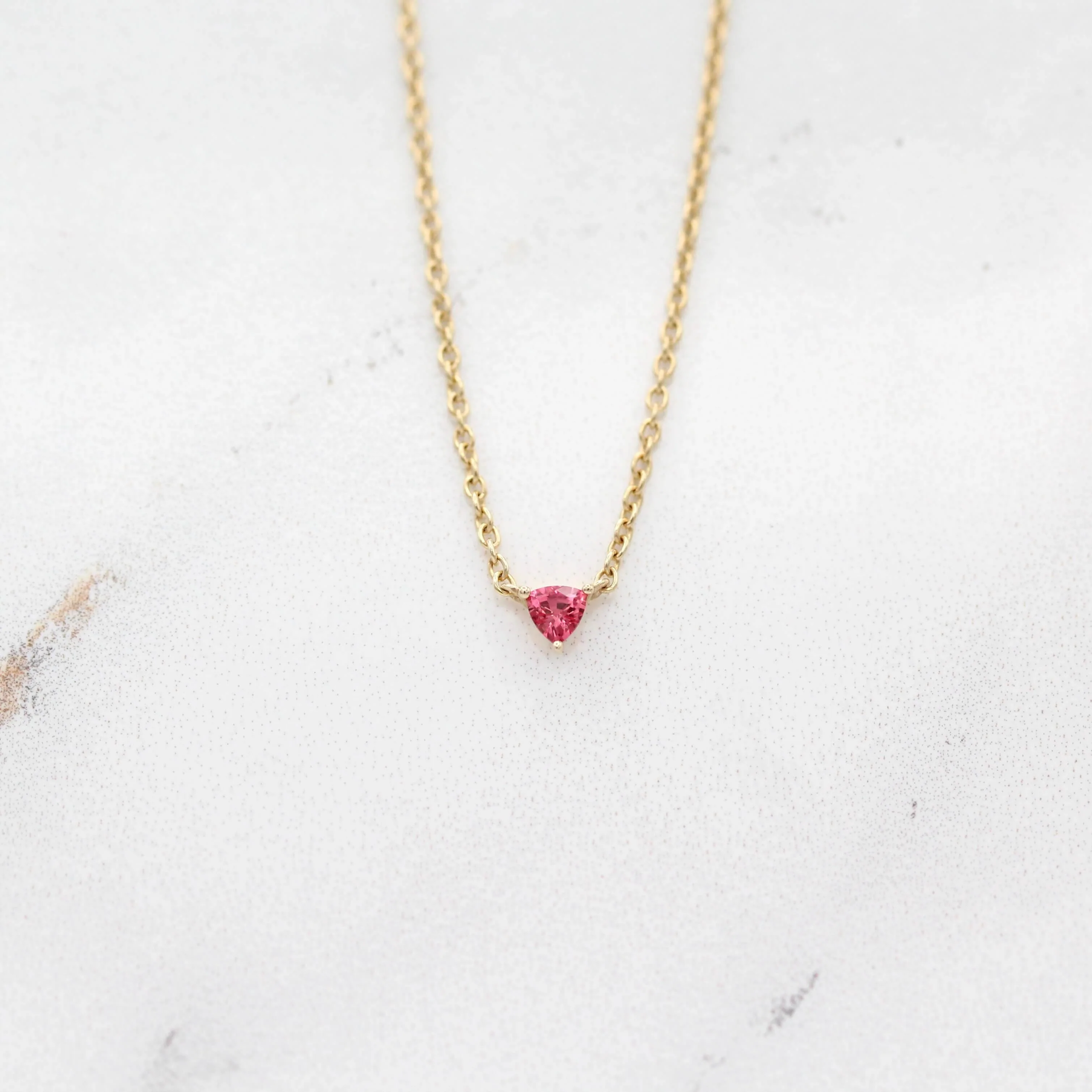 The January Tiny Trillion Birthstone Necklace with Padparadscha Sapphire in Yellow Gold