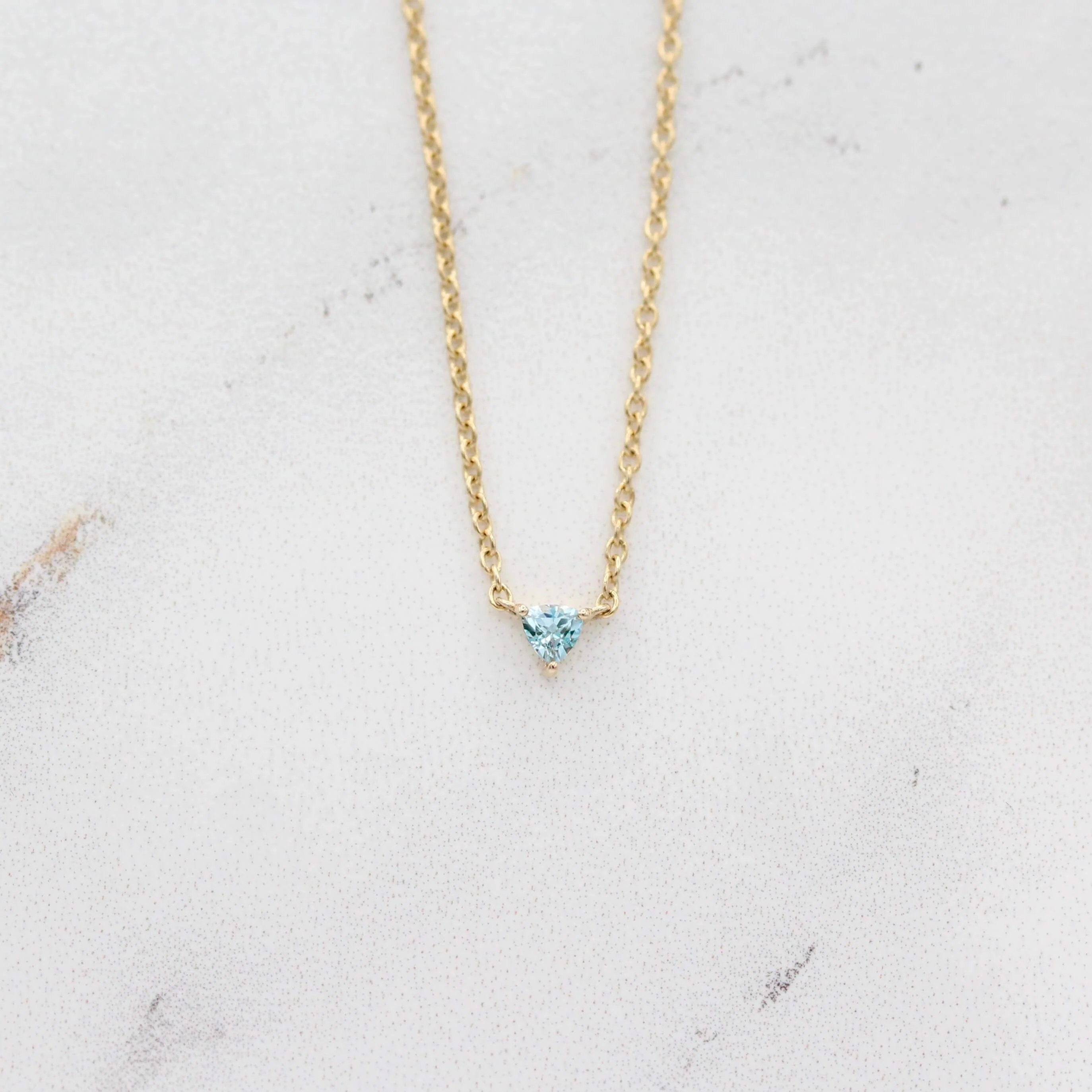The March Tiny Trillion Birthstone Necklace with Aqua Spinel in Yellow Gold