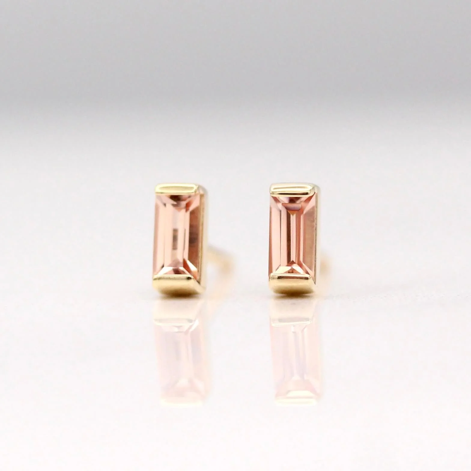 The October Baguette Birthstone Earrings with Peachy-Pink Sapphire in Yellow Gold - Image 5